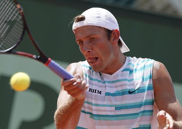 Łukasz Kubot w pojedynku z Nicolasem Almagro. /AFP