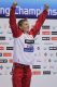 Radosław Kawęcki na podium fetuje zdobycie złogego medalu na 200 m st. grzbietowym