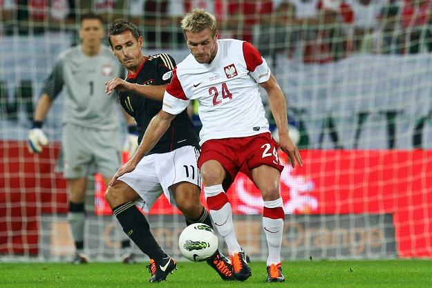 Reprezentujący Polskę Damien Perquis (z prawej) i Niemcy Miroslav Klose /AFP