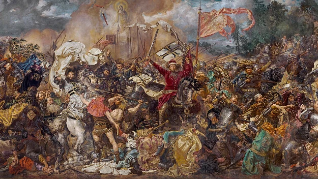 intensywna scena bitewna z licznymi walczącymi rycerzami w zbrojach, powiewającymi sztandarami, przewracającymi się końmi i dramatycznymi pojedynkami na środku pola; centralnie widoczny dowódca w czerwonym płaszczu wyciągający miecz w górę, wokół chaos...