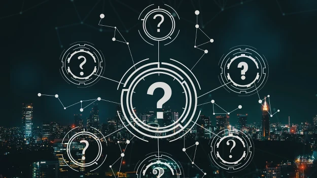 Centralny symbol zapytania otoczony mniejszymi ikonami zapytania, na tle rozświetlonego miasta nocą, z graficznymi połączeniami sugerującymi sieć lub nowoczesną technologię. Centralny symbol zapytania otoczony mniejszymi ikonami zapytania, na tle rozświetlonego miasta nocą, z graficznymi połączeniami sugerującymi sieć lub nowoczesną technologię.