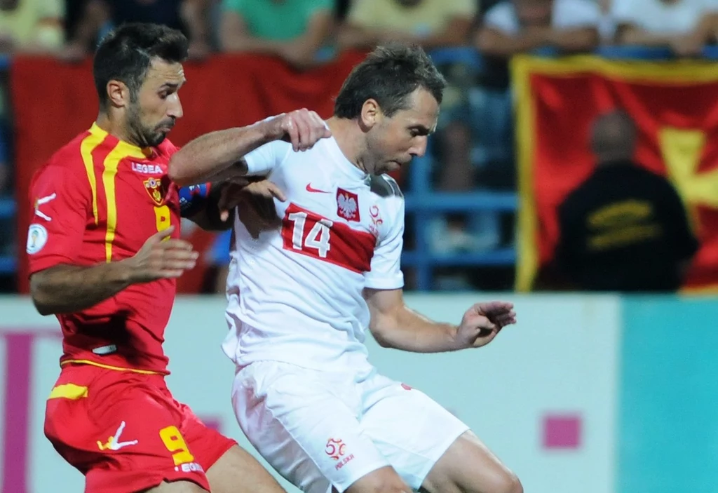 Mirko Vucinic i Jakub Wawrzyniak podczas meczu Czarnogóra - Polska Mirko Vucinic i Jakub Wawrzyniak podczas meczu Czarnogóra - Polska