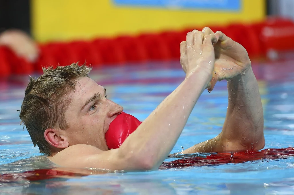 Czasem 1.48,48 ustanowił rekord Polski. Słynnego Amerykanina Ryana Lochtego pokonał o zaledwie 0,02 s.