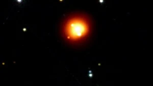 Promienie gamma (pomarańczowe i czerwone) podczas błysku w gwiazdozbiorze Kila