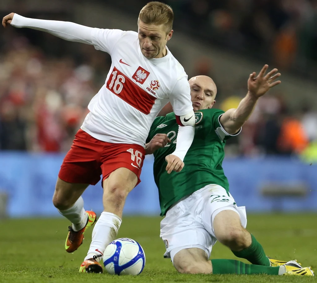 Jakub Błaszczykowski atakowany przez Conora Sammona Jakub Błaszczykowski atakowany przez Conora Sammona