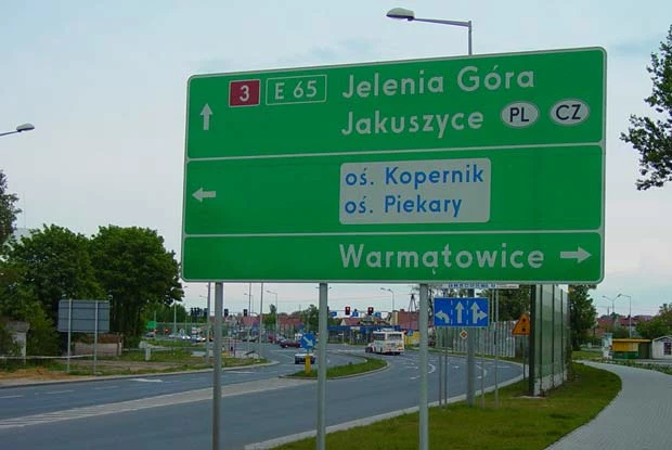 Kliknij