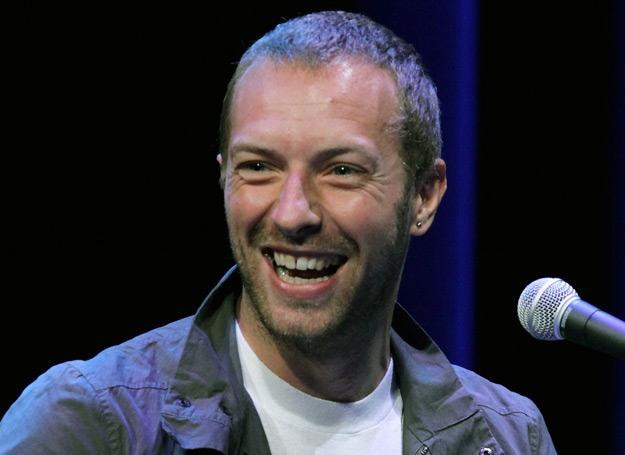 Chris Martin (Coldplay) najwyraźniej cieszy się na wizytę w Polsce - fot. Justin Sullivan