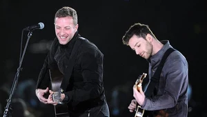 Chris Martin i wart million funtów Guy Berryman fot. Jason Merritt