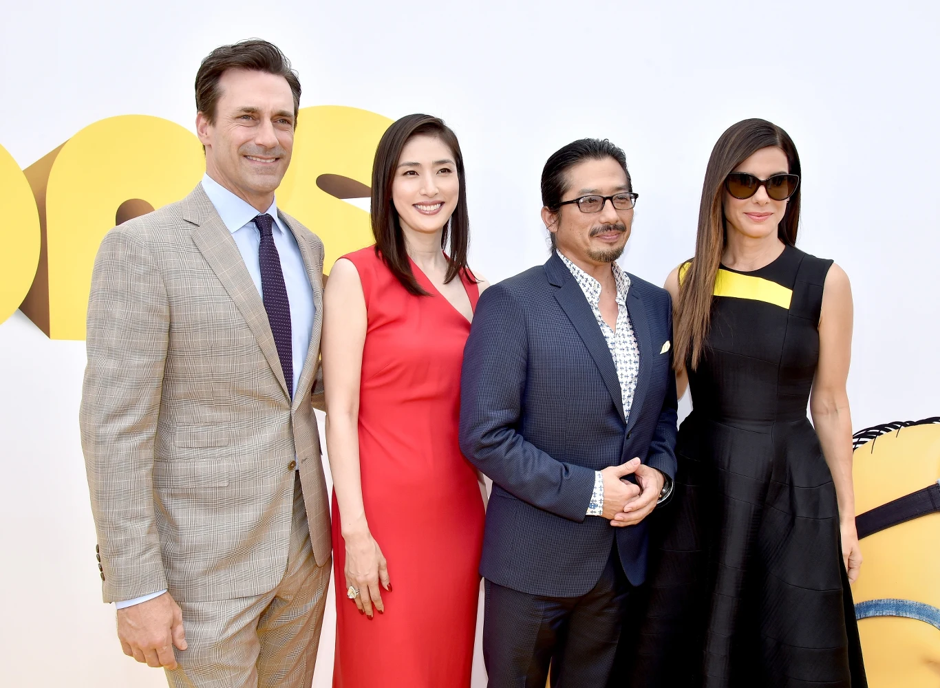 Jon Hamm i Sandra Bullock podczas promocji "Minionków" Jon Hamm i Sandra Bullock podczas promocji "Minionków"