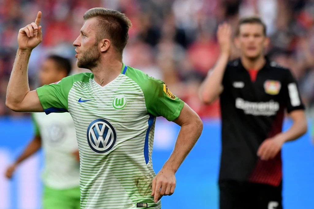 Jakub Błaszczykowski (L) cieszy się z gola w meczu z Bayerem Leverkusen