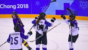 Finland celebrate a goal against Sweden in the Women's hockey tournament