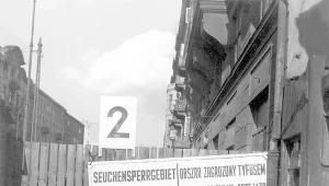 Tablica z ostrzeżeniem o zagrożeniu tyfusem