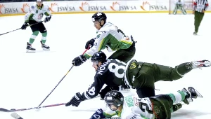 Hokeiści JKH GKS Jastrzębie Kamil Wałęga i Dominik Paś oraz Peter Novajovsky z GKS Tychy podczas meczu o Superpuchar Polski