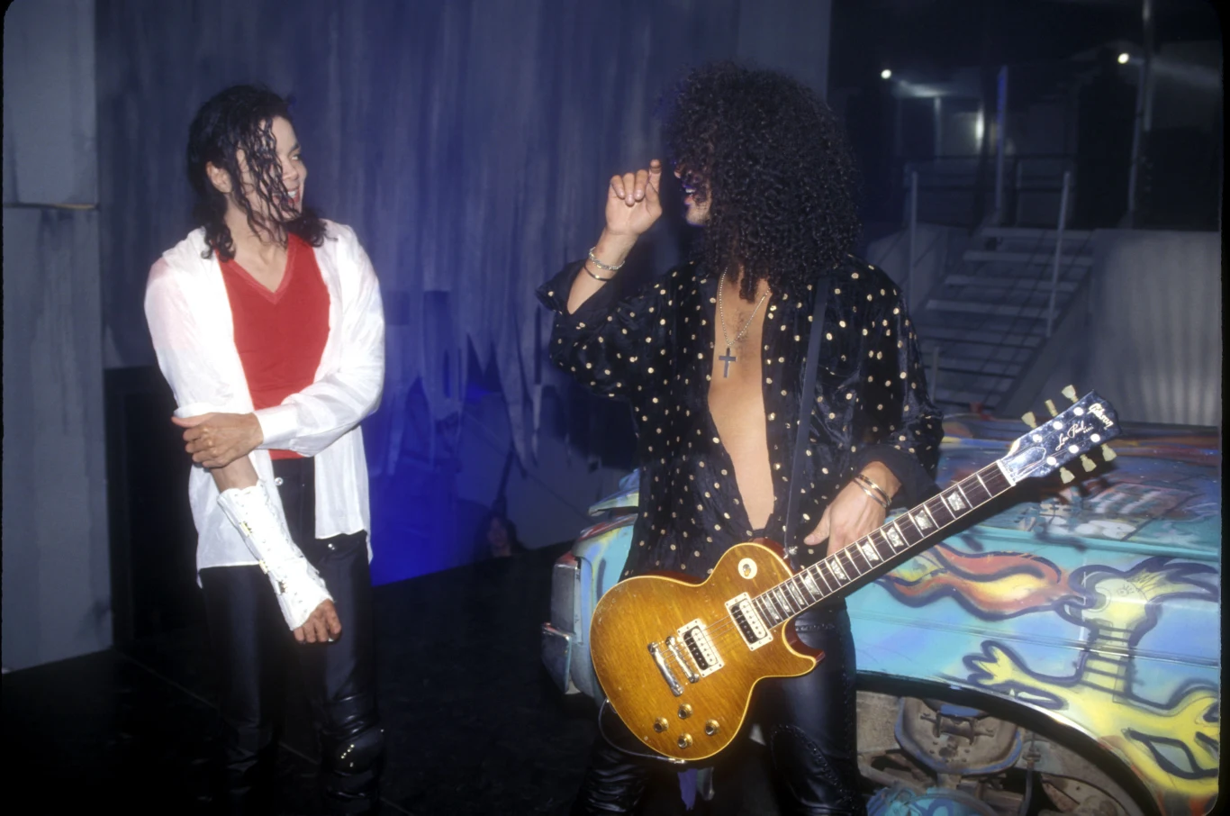 W 1991 r. doszło do niezwykłej współpracy Slasha z Michaelem Jacksonem. Razem nagrali utwór "Give In To Me" z płyty "Dangerous". Gitarzysta zagrał też we wstępie do teledysku "Black or White" z tego samego albumu. Drogi Slasha z Królem Popu krzyżowały się jeszcze kilkakrotnie - zagrał także w utworach "D.S.", "Morphine" i "Privacy". Razem występowali na scenie podczas m.in. MTV Video Music Awards 1995.