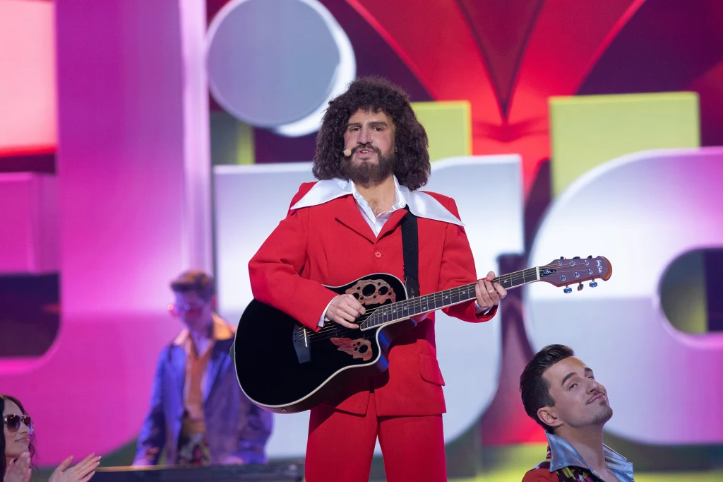 Natalia Avelon jako George Baker Natalia Avelon jako George Baker