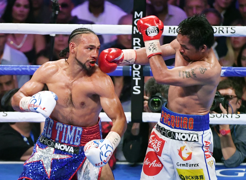 Manny Pacquiao (z prawej) w starciu z Keithem Thurmanem Manny Pacquiao (z prawej) w starciu z Keithem Thurmanem