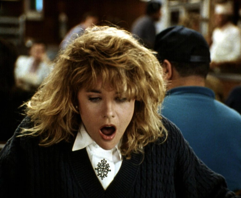 Meg Ryan w kultowej scenie orgazmu z filmu "Kiedy Harry poznał Sally"