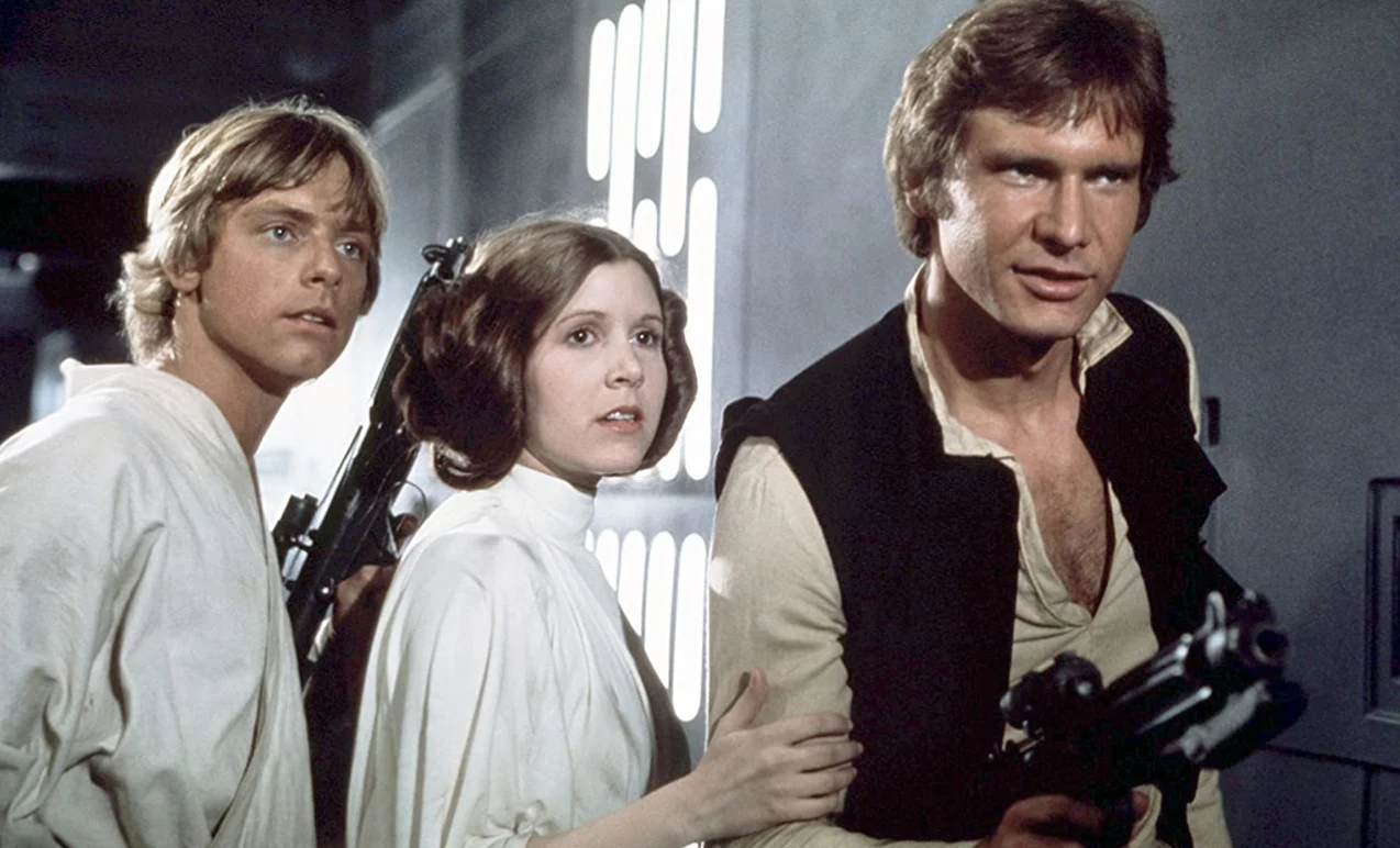 Mark Hamill, Carrie Fisher i Harrison Ford w filmie z 1977 roku "Gwiazdne wojny: Nowa nadzieja"