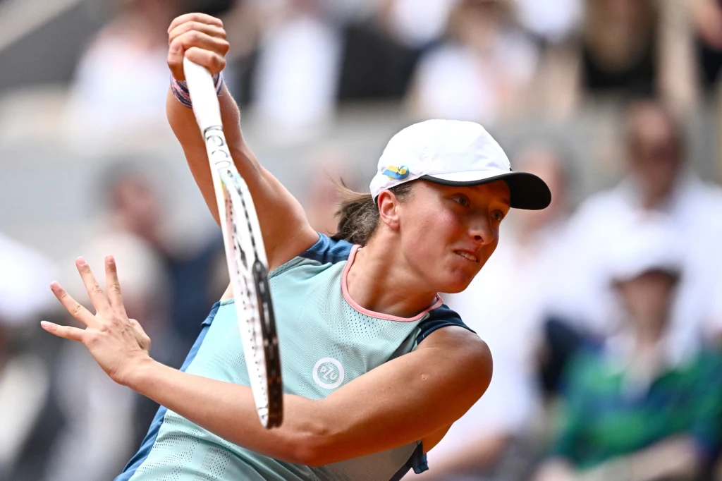 Poland's Iga Swiatek returns the ball to US' Coco Gauff during the women's singles final match, on day fourteen of the Roland-Garros Open tennis tournament at the Court Philippe-Chatrier in Paris on June 4, 2022. Anne-Christine POUJOULAT / AFP