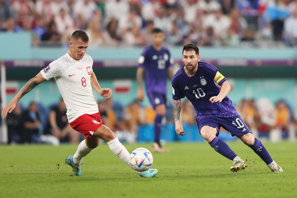 Damian Szymański i Lionel Messi Damian Szymański i Lionel Messi