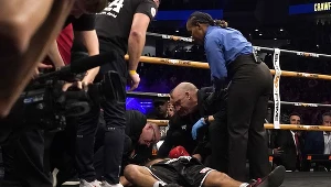 Dawid Awanesjan leży na deskach, przy nim sztab ludzi