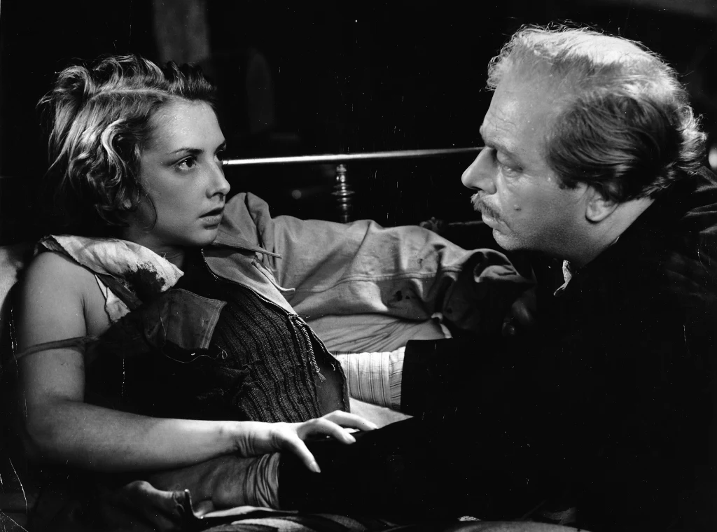 Zofia Mrozowska, Jan Kurnakowicz 1950 rok. Kadr z filmu "Miasto nieujarzmione" w reżyserii Jerzego Zarzyckiego Zofia Mrozowska, Jan Kurnakowicz 1950 rok. Kadr z filmu "Miasto nieujarzmione" w reżyserii Jerzego Zarzyckiego