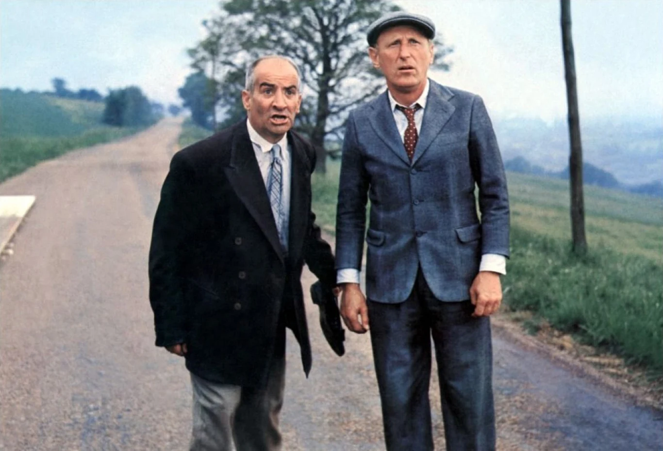 Louis de Funes i Bourvil w scenie z filmu "Wielka włóczęga"