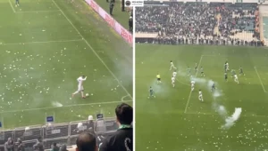 Dantejskie sceny podczas meczu. Kibice rzucali w piłkarzy petardami