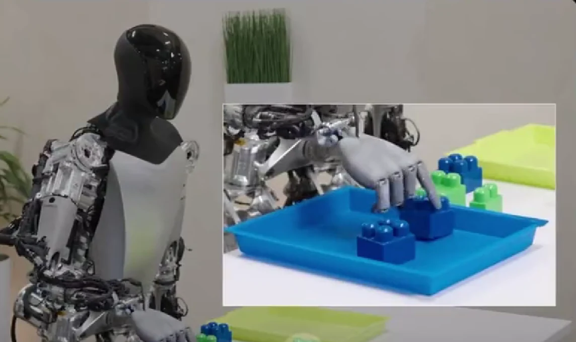 Robot Tesli lokalizuje klocki dzięki kamerom umieszczonym w dłoniach Robot Tesli lokalizuje klocki dzięki kamerom umieszczonym w dłoniach