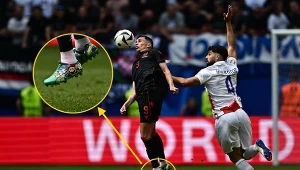 Jasir Asani w butach zdobionych wizerunkiem bohatera popularnej serii gier Nintendo, Mario Bros.