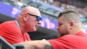 Paweł Fajdek z trenerem Szymonem Ziółkowskim