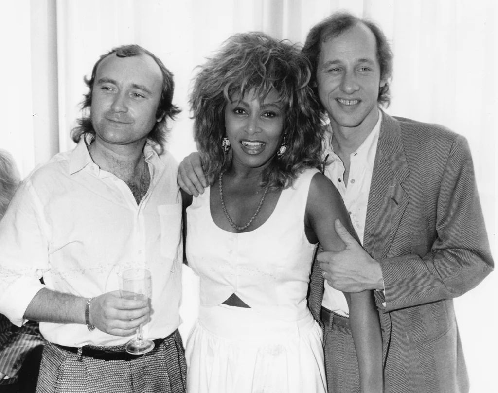 Phil Collins, Tina Turner i Mark Knopfler w 1986 r.