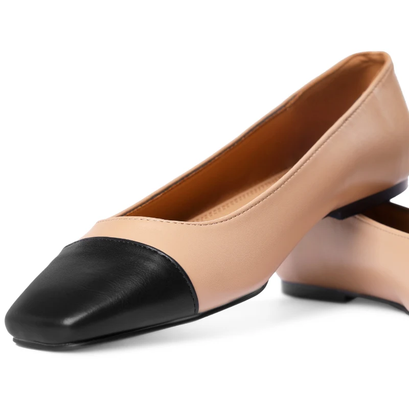 Płaskie buty z czarnym noskiem mają wiele wariantów