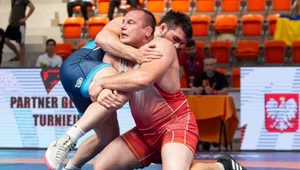 Kamil Kościółek (w czerwonym stroju)