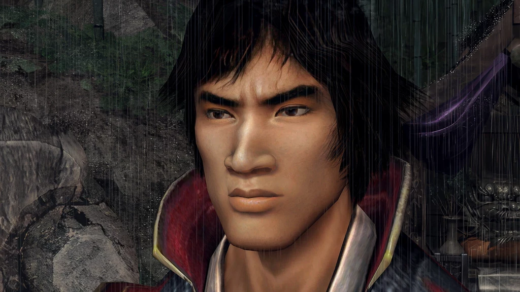 Onimusha 2: Samurai’s Destiny Remastered Młody mężczyzna o surowym wyrazie twarzy, ciemne włosy, ubrany w ciemny strój z czerwonym kołnierzem, w tle widoczne skały i fragmenty przyrody, całość w scenerii padającego deszczu.
