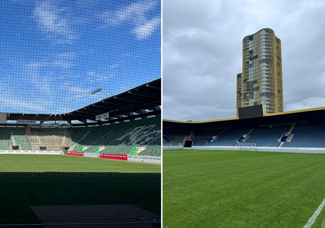 Pusta murawa stadionu sportowego otoczona trybunami, po prawej stronie widoczny wysoki wieżowiec w tle, a nad stadionem rozciąga się siatka ochronna oraz niebo częściowo pokryte chmurami.
