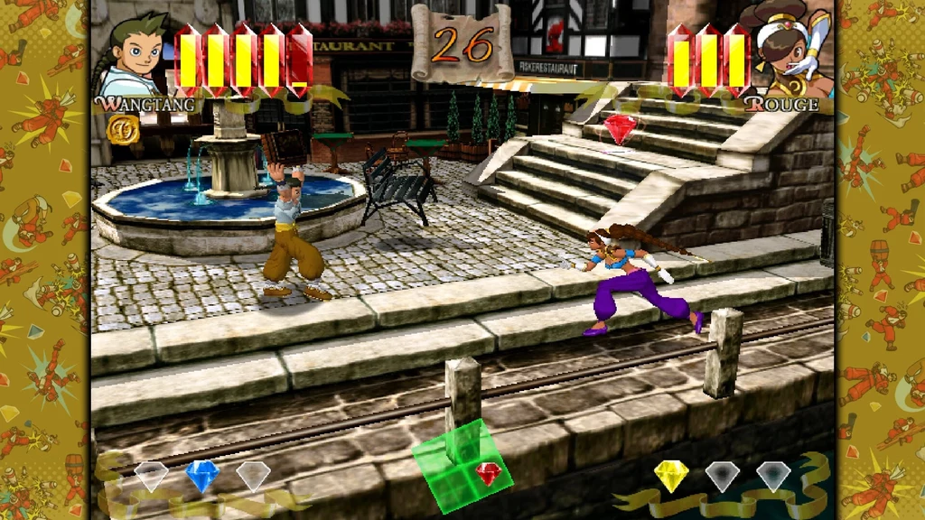 Capcom Fighting Collection 2 Dwóch bohaterów walczy w kolorowej, trójwymiarowej scenerii miejskiej z fontanną i schodami, na ekranie widoczne są paski energii oraz kolorowe diamenty będące elementami rozgrywki.