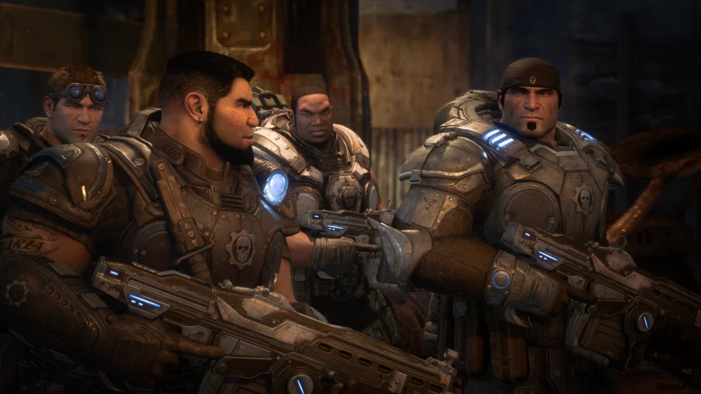 Gears of War: Reloaded Grupa czterech fikcyjnych żołnierzy w ciężkich pancerzach i z zaawansowaną bronią, stojący razem w mrocznym, przemysłowym otoczeniu, gotowi do działania