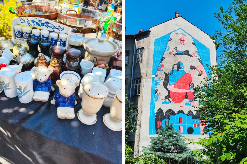 Zestaw porcelanowych figurek misiów i innych ceramiki na targu staroci, obok mural na bocznej ścianie kamienicy, przedstawiający abstrakcyjną postać w jaskrawych kolorach w otoczeniu elementów architektonicznych i natury.