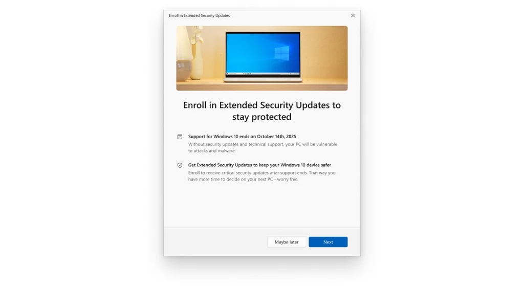 Ekran komputera z komunikatem dotyczącym zapisania się do rozszerzonych aktualizacji zabezpieczeń systemu Windows. W górnej części widoczna grafika przedstawiająca monitor z niebieskim pulpitem, poniżej szczegóły i opcje dotyczące wyboru aktualizacji.