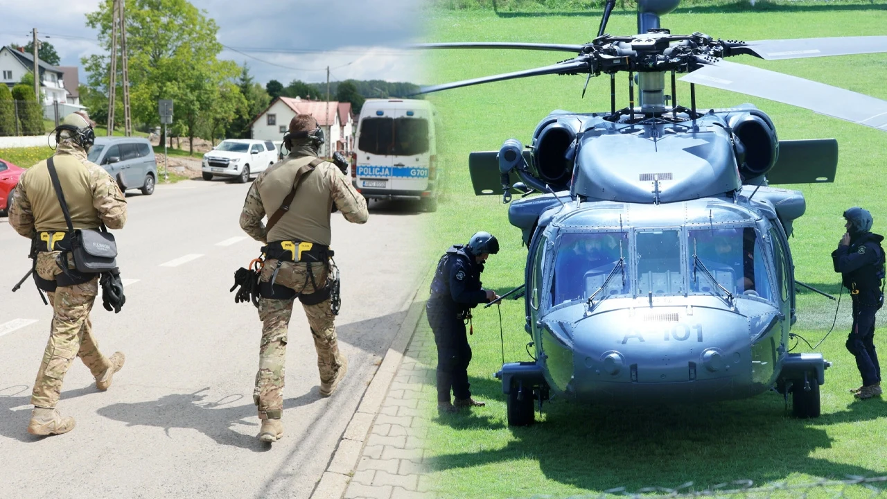 Ekspert o działaniach policji w Starej Wsi Uzbrojeni funkcjonariusze służb specjalnych idą ulicą w kierunku zaparkowanych pojazdów, po drugiej stronie kadru grupa żołnierzy przygotowuje się przy wojskowym śmigłowcu stojącym na zielonym trawniku.