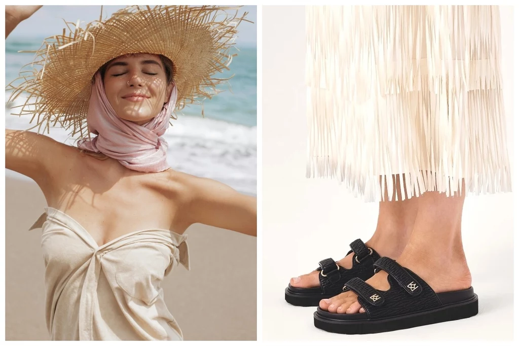 Buty na lato. Fot. Pexels.com, @kazar Młoda kobieta w słomkowym kapeluszu i jasnej sukience z apaszką na szyi stoi na plaży przy słonecznej pogodzie; obok widoczne są stopy w czarnych klapkach oraz biała, frędzlowana spódnica.