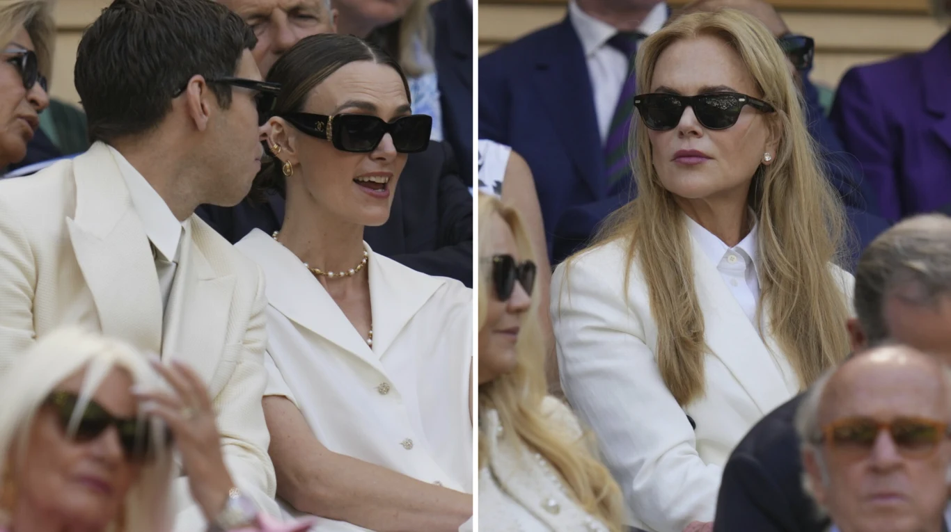 Keira Knightley i Nicole Kidman na Wimbledonie Elegancko ubrani ludzie w białych marynarkach siedzą wśród publiczności, większość z nich ma założone ciemne okulary przeciwsłoneczne, rozmawiają lub patrzą na wydarzenie przed sobą.
