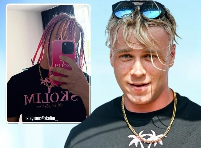 Mężczyzna z blond włosami i okularami na głowie uśmiecha się do kamery, nosi czarną koszulkę z różowym nadrukiem i złoty łańcuszek; na drugim planie widoczna jest selfie innej osoby z kolorowymi warkoczykami i telefonem zasłaniającym twarz, ubraną w id...