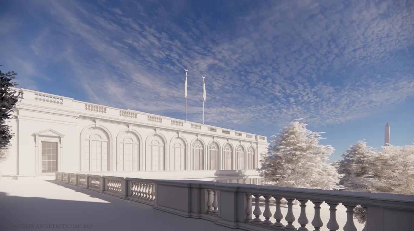 Jasna elewacja klasycznego budynku z licznymi wysokimi oknami i balustradą na pierwszym planie, otoczenie stanowią drzewa pokryte śniegiem, na niebie widoczne rozproszone chmury, w tle charakterystyczny monument.