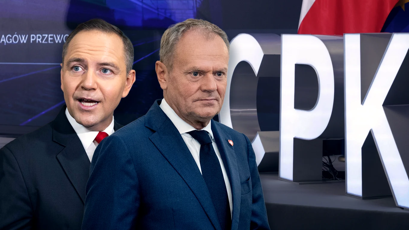Karol Nawrocki zwrócił się do polityków rządu Donalda Tuska Dwóch mężczyzn ubranych w garnitury znajduje się na tle napisu CPK oraz polskiej flagi, tło jest częściowo rozmyte i sugeruje oficjalny kontekst lub konferencję prasową.