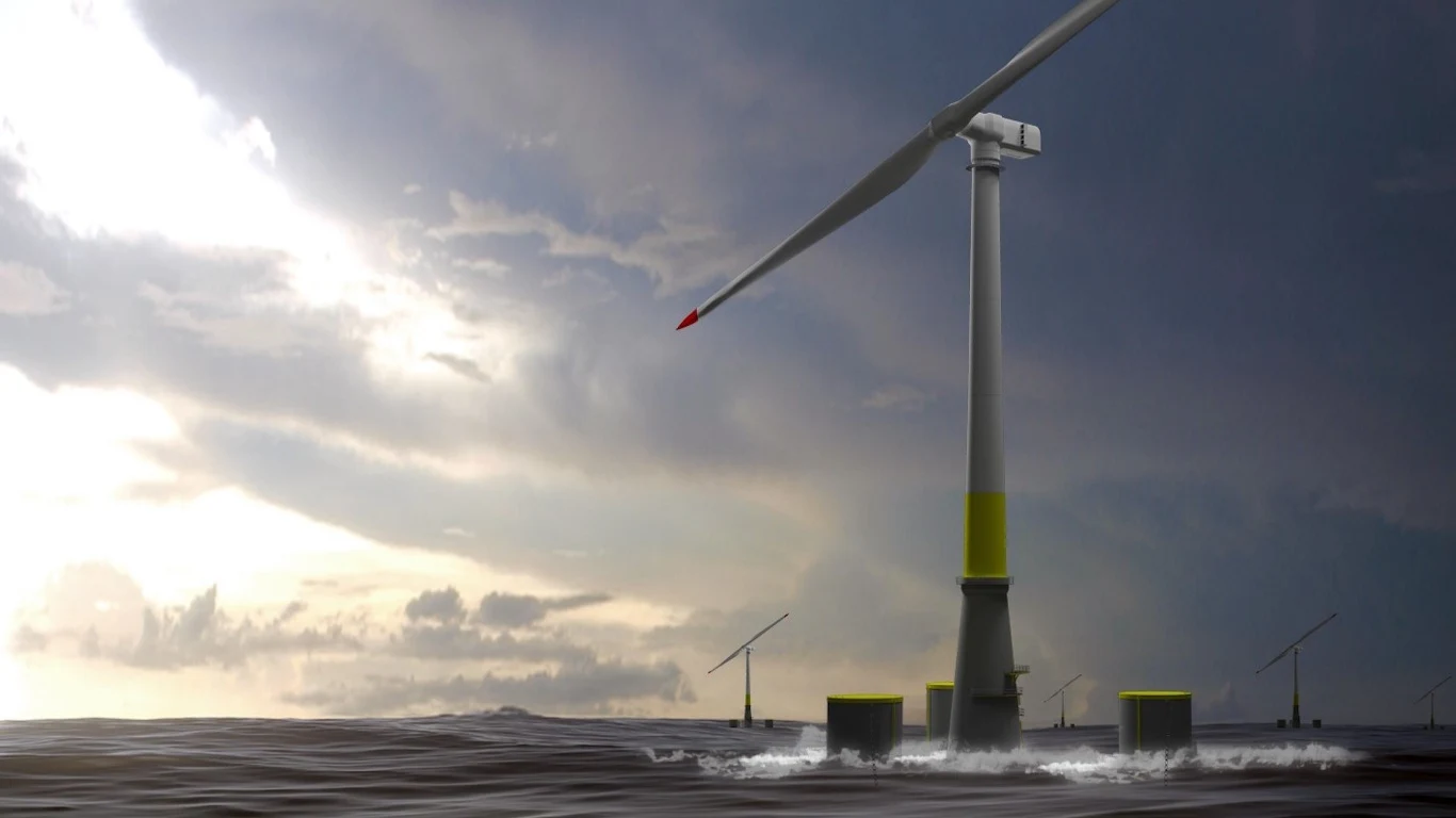 Chińczycy stworzyli przełomową turbinę. Testy odbywały się w tajemnicy. Morska elektrownia wiatrowa z dużą turbiną zamocowaną na platformie w oceanie, kilka mniejszych turbin w tle na tle pochmurnego nieba, światło słoneczne przebija się przez chmury.