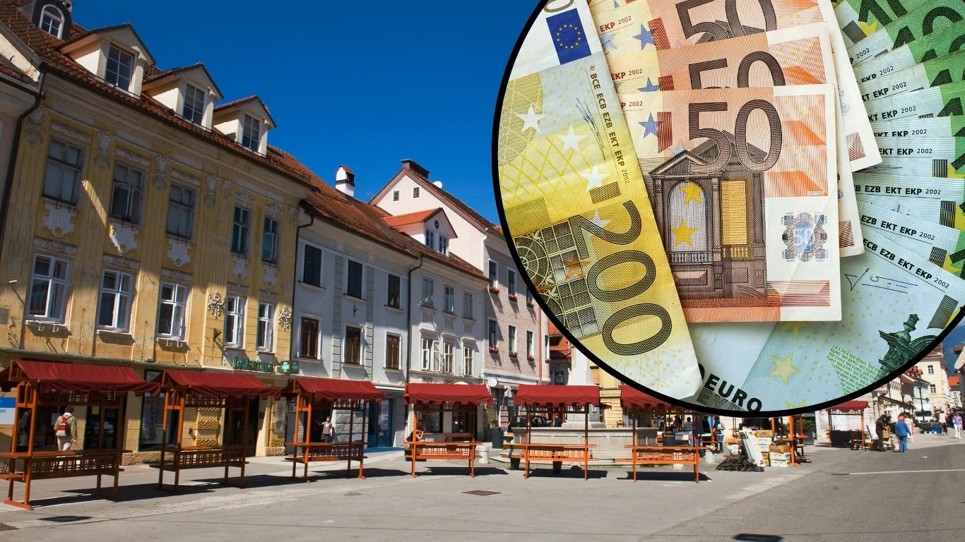 Trwają poszukiwania szczęśliwca. Wygrał miliony i nie zgłosił się po nagrodę Kolorowe historyczne kamienice z rynku miasteczka, a na pierwszym planie powiększenie eurobanknotów o różnych nominałach.