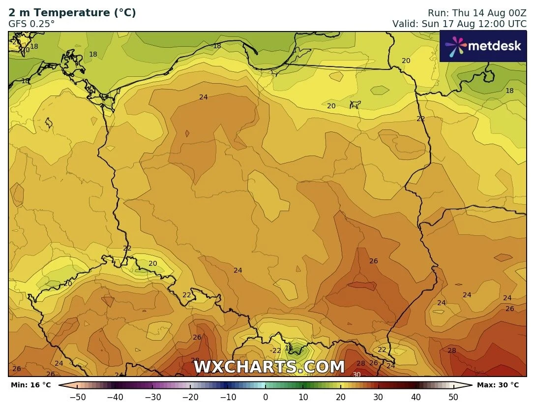 Kolorowa mapa Polski z prognozą temperatury na poziomie 2 metrów, gdzie dominują odcienie żółci, pomarańczu i czerwieni symbolizujące temperatury od 16°C do 30°C, najwyższe wartości na południowym wschodzie kraju, najniższe na północnym zachodzie.