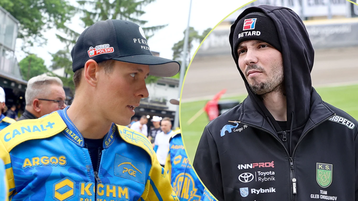 Oskar Fajfer oraz Gleb Czugunow Dwóch żużlowców ubranych w charakterystyczne kombinezony swoich drużyn, jeden z nich w niebiesko-żółtym stroju z logo sponsorów, drugi w czarnej bluzie z naszywkami i czapką, w tle stadion żużlowy.